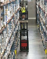 Raymond 5000 Series Orderpicker in warehouse aisle